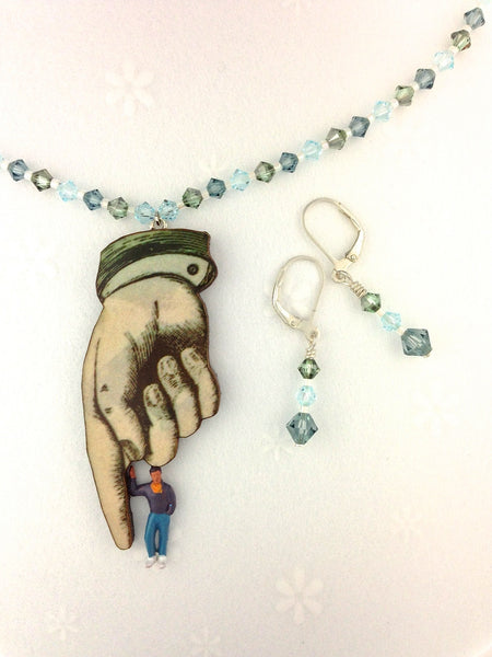 hand in bead chains necklace and earrings