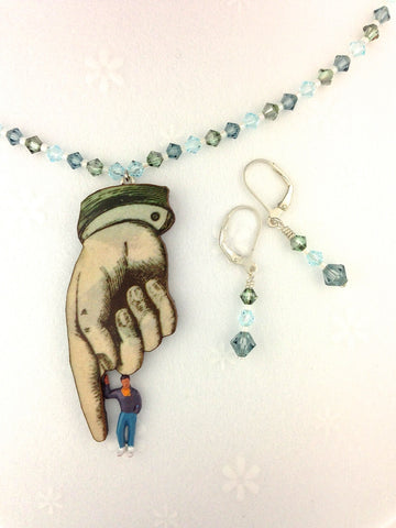 hand in bead chains necklace and earrings